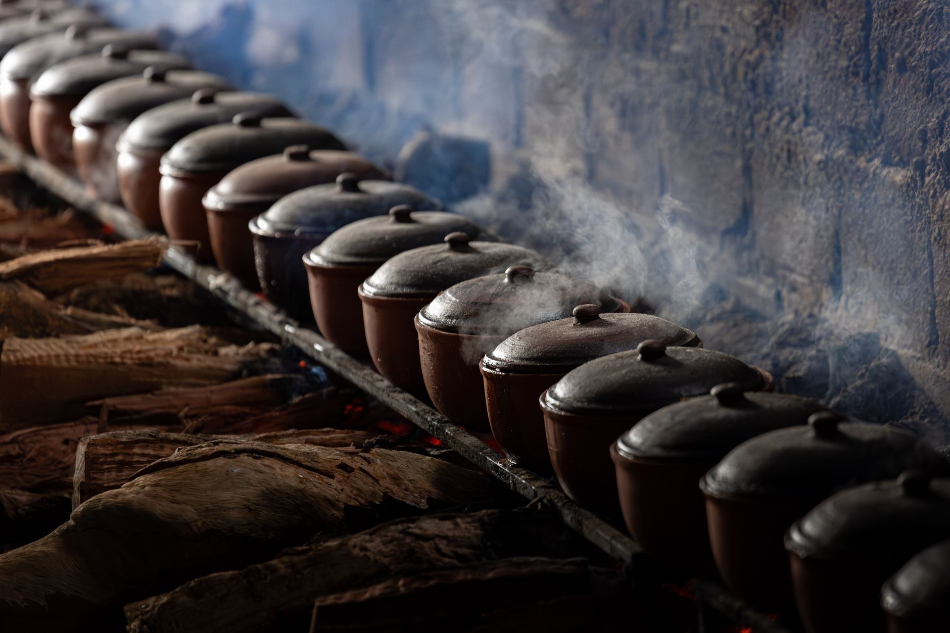 Fresh clay cookware and traditional spices in an artisan kitchen