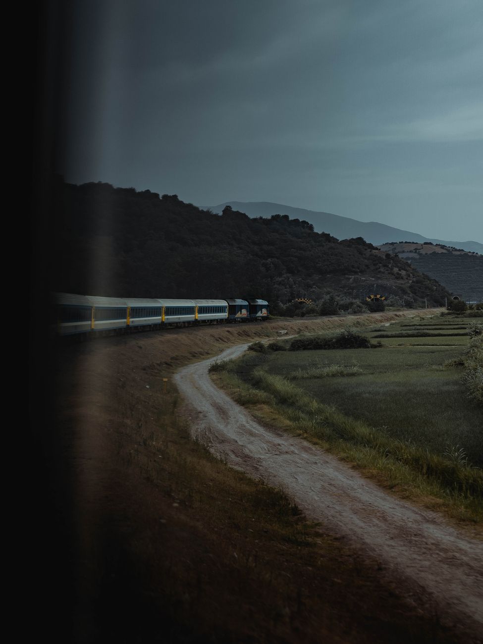 Scenic train route rolling through alpine countryside